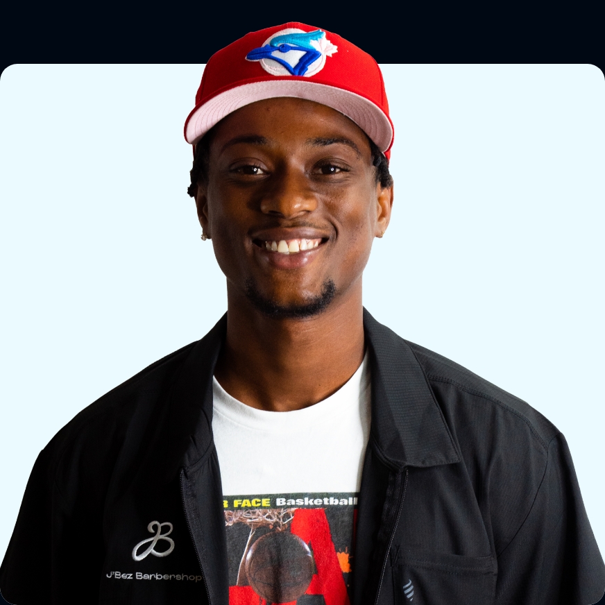 man with red hat and white shirt smiling