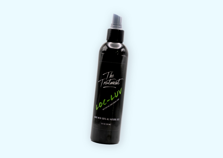 black spray bottle of hair care product